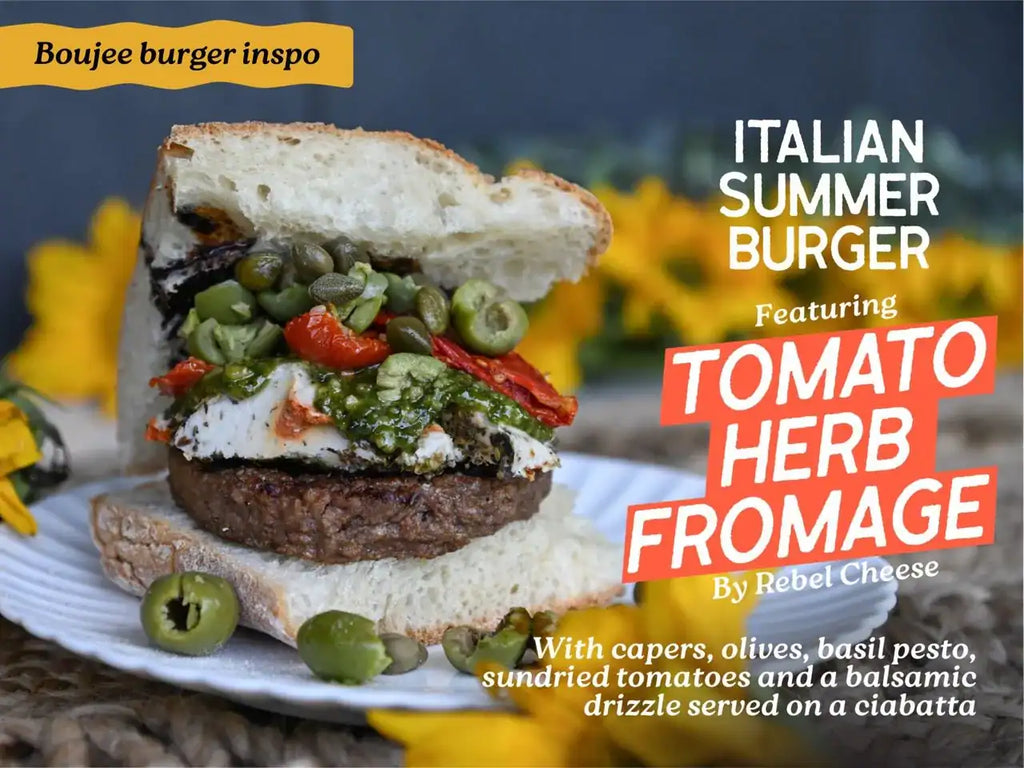 Italian summer burger with tomato herb fromage on a plate, surrounded by yellow flowers.