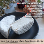 A wedge and half of soft white plant-based Brie cheese on a dark plate, with text overlays highlighting clean ingredients and a bottom banner reading 'Just the cleanest plant-based ingredients.'.