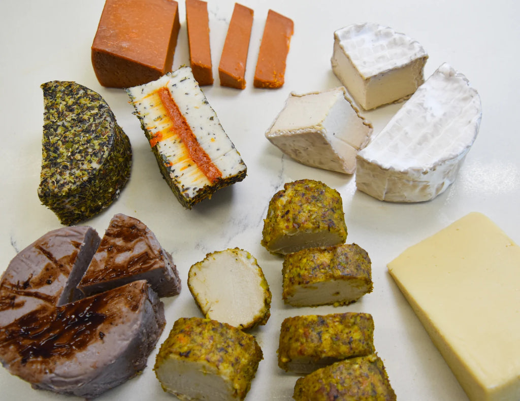 Assorted types of cheese on a white surface