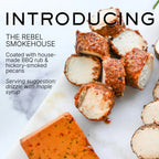 Brand new Rebel Cheese Smokehouse Pecan Chevre dairy-free cheese made with in-house BBQ rub and hickory-smoked pecans on a marble surface.