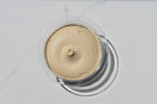 Rebel Cream Cheese in a clear container on a white background
