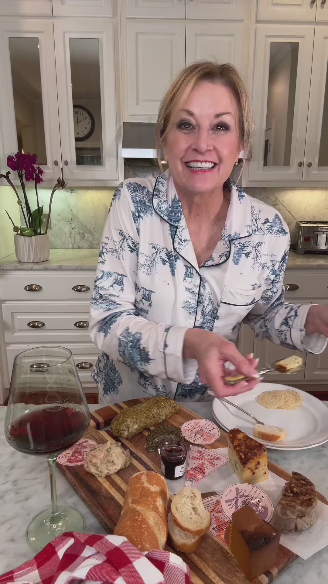 a woman talking about how she enjoys pampering herself with wine and cheese