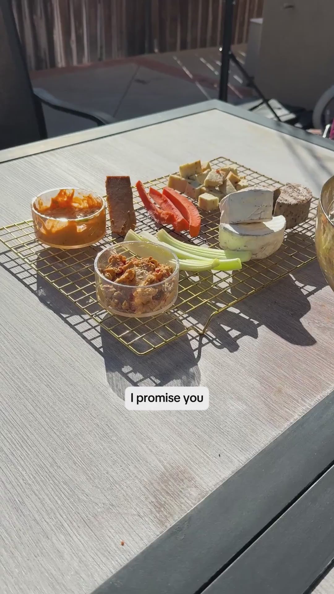 a man talking about how he enjoys Rebel Cheese products with his backyard BBQ food