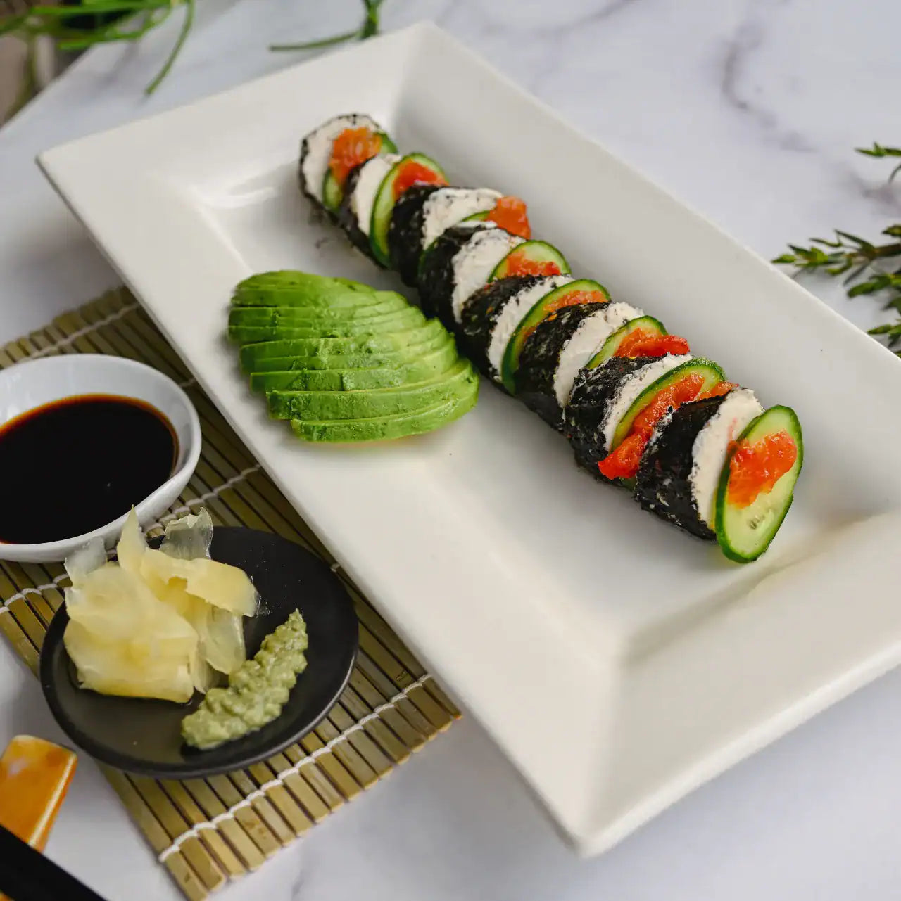 Sliced Rebel Roll vegan cheese showing creamy cashew center and savory nori coating