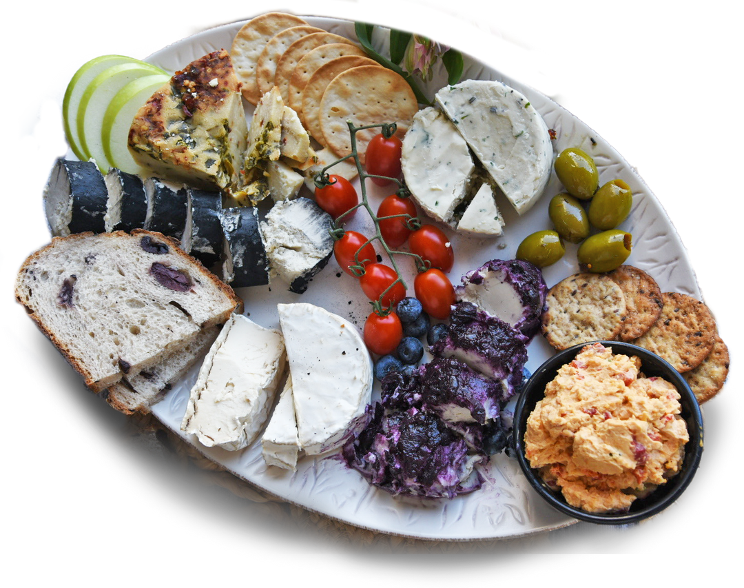 assorted vegan cheeses and crackers on a platter 