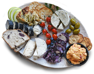 assorted vegan cheeses and crackers on a platter 